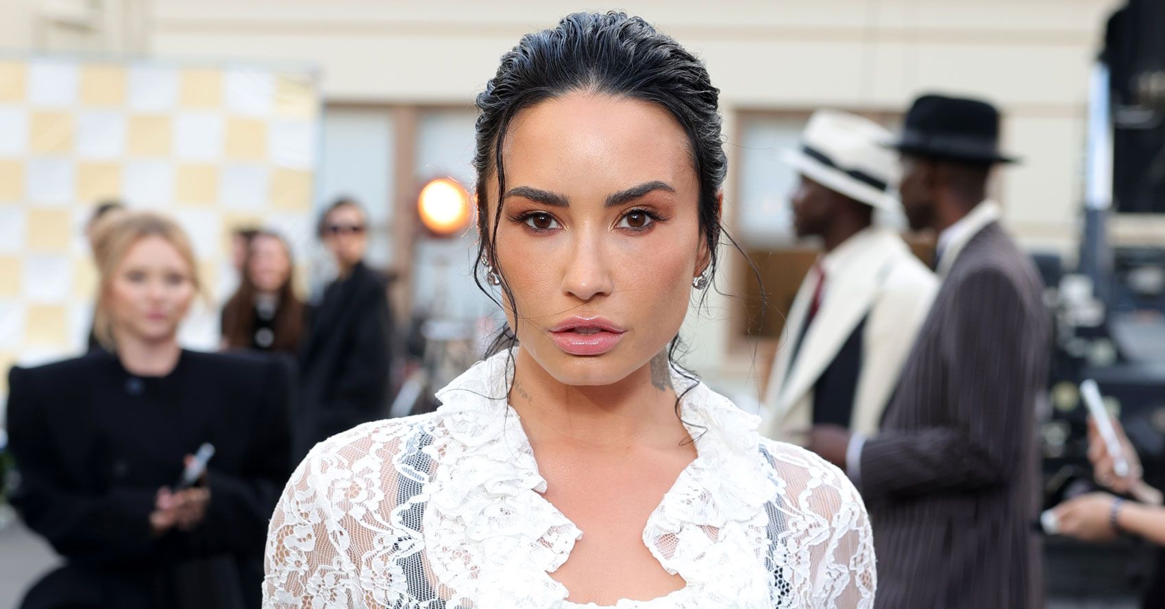 Demi Lovato’s Skirt Development Makes Black Tights Look Stylish
