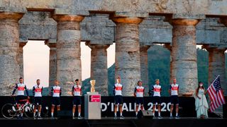 Team Trek Segafredo rider Italys Vincenzo Nibali L and teammates pose on stage at the Doric Temple of Segesta near Palermo Sicily on October 1 2020 during an opening ceremony of presentation of participating teams and riders two days ahead of the departure of the Giro dItalia 2020 cycling race Photo by Luca Bettini AFP Photo by LUCA BETTINIAFP via Getty Images