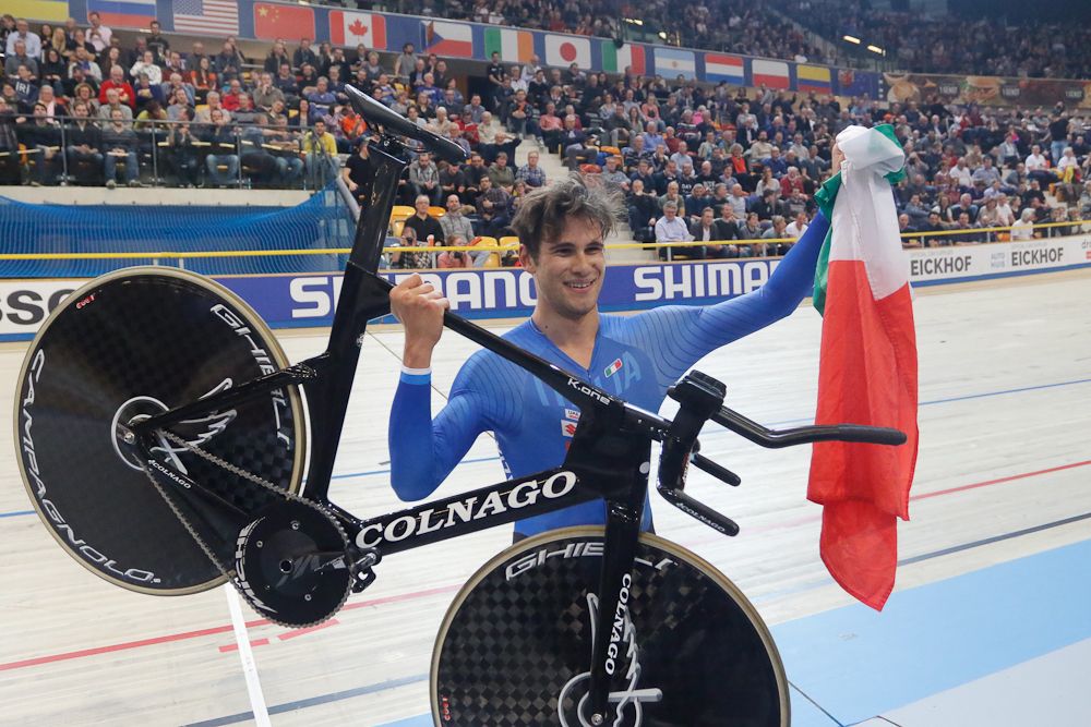 Filippo Ganna (Italy) hoists his machine after winning the Individual Pursuit world championship