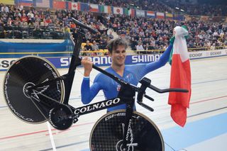 Filippo Ganna (Italy) hoists his machine after winning the Individual Pursuit world championship