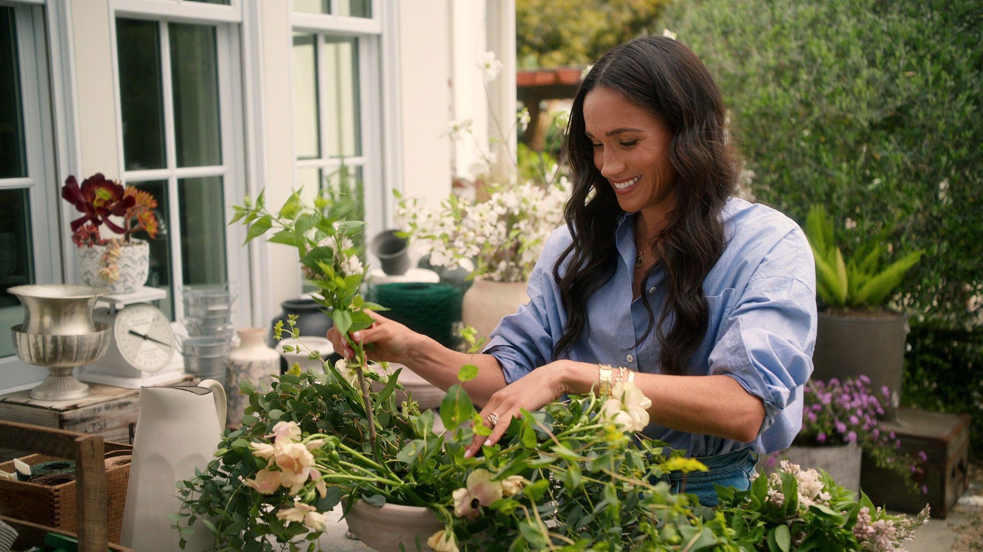 Meghan Sussex arranges flowers