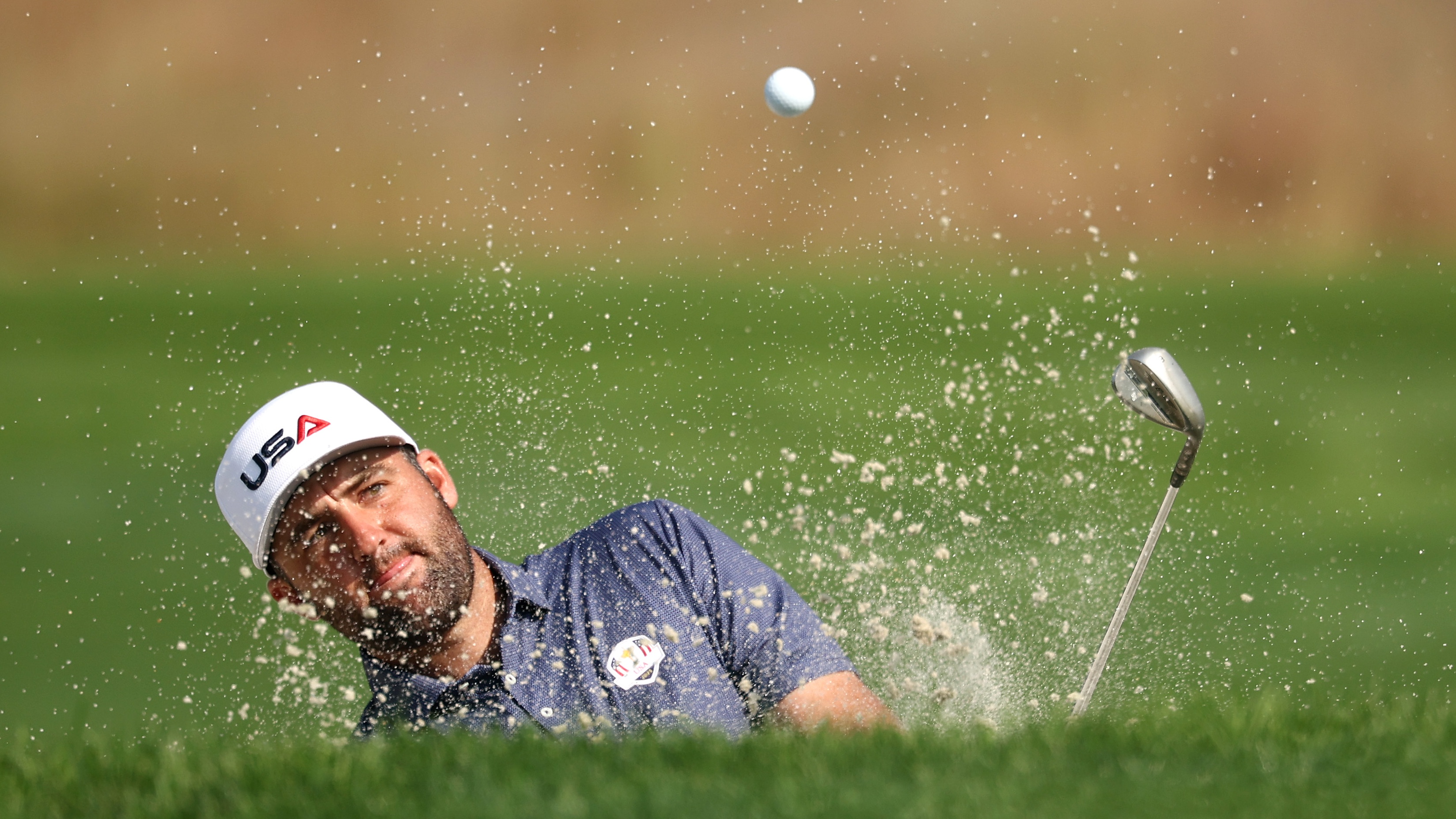 Scottie Scheffler of Team United States hits a greenside bunker shot on the 11th hole prior to the Ryder Cup 2025 at Black Course at Bethpage State Park Golf Course on September 23, 2025 in Farmingdale, New York.