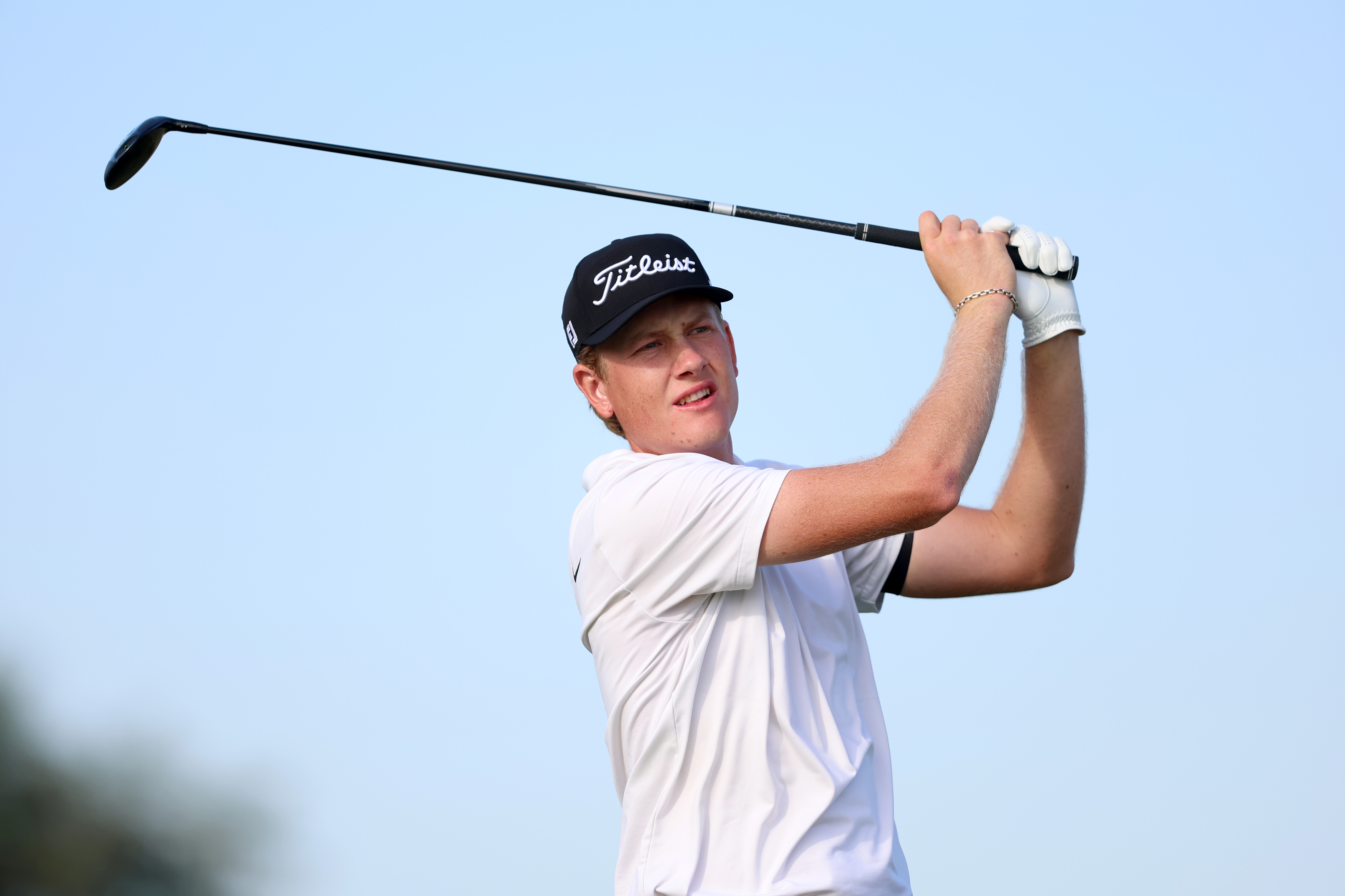 Luke Poulter hits a fairway wood shot at Open Final Qualifying