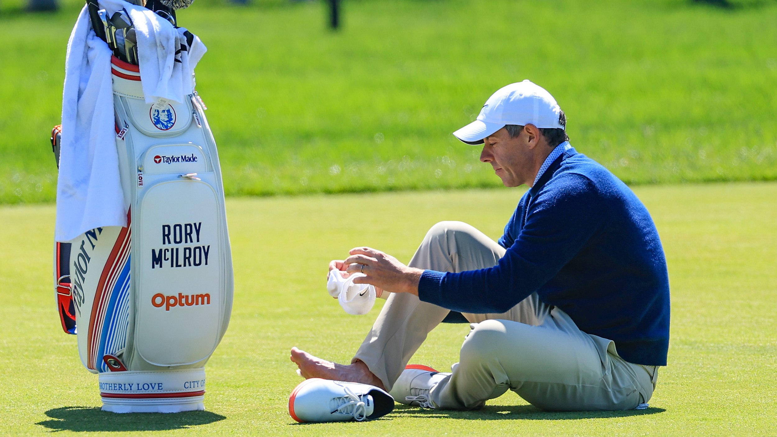 Rory McIlroy deals with a blister during a practice round for the PGA Championship at Aronimink 