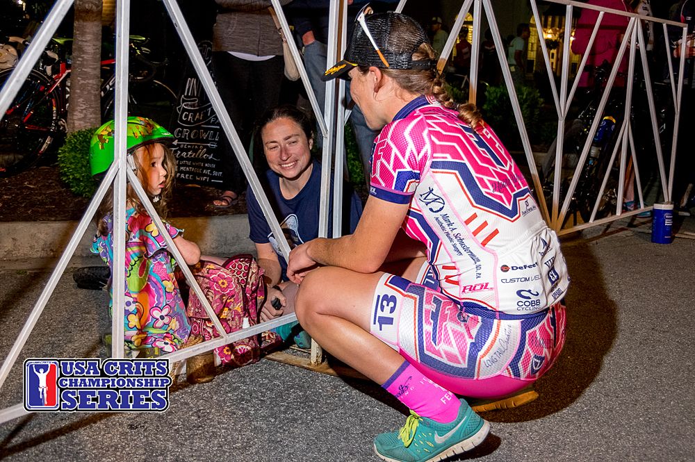 Race winner Lauretta Hanson takes a minute with a budding racer before her podium presentation