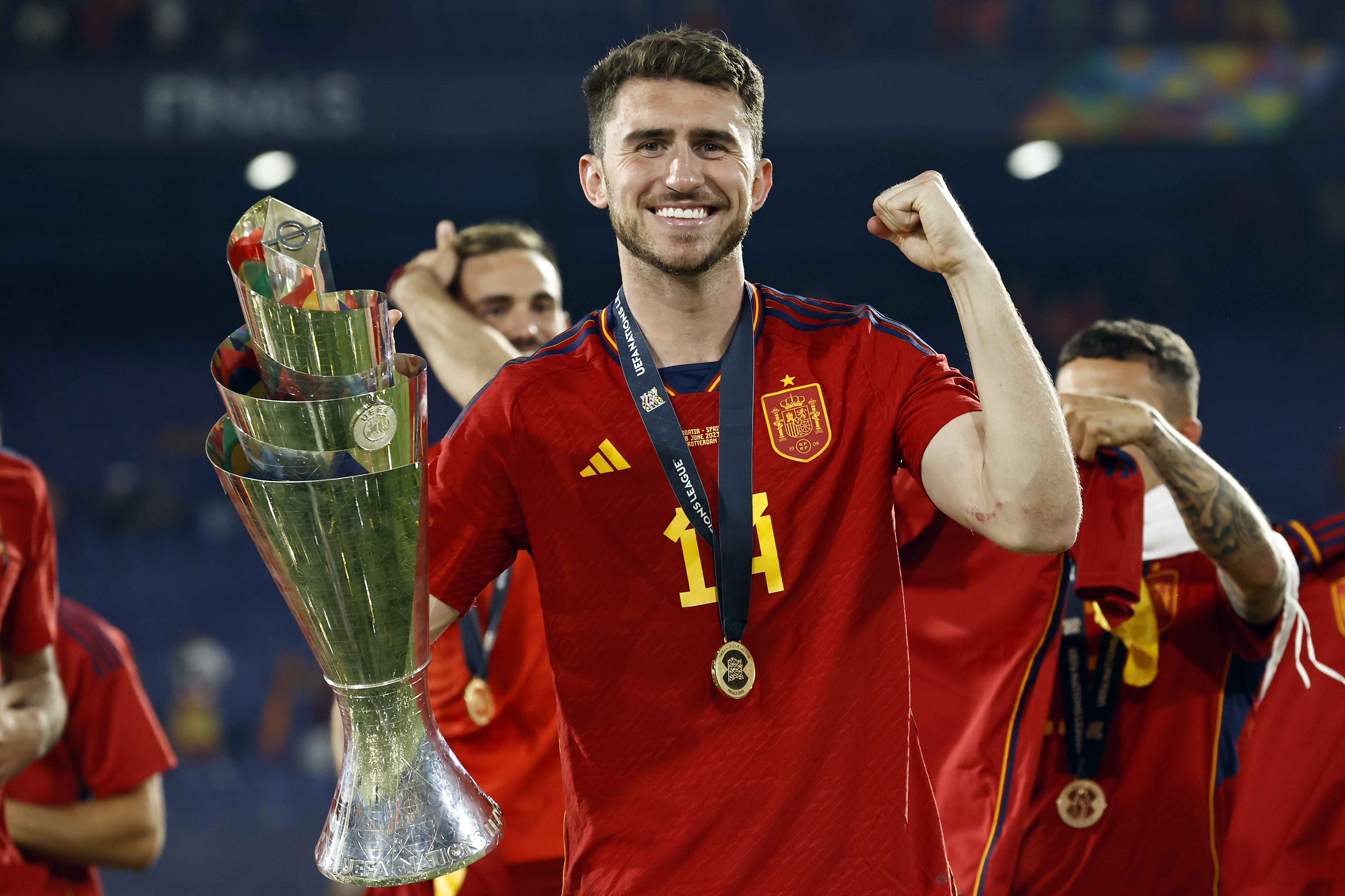 Aymeric Laporte celebrates with the UEFA Nations League trophy after Spain's win over Croatia in the final in 2023.