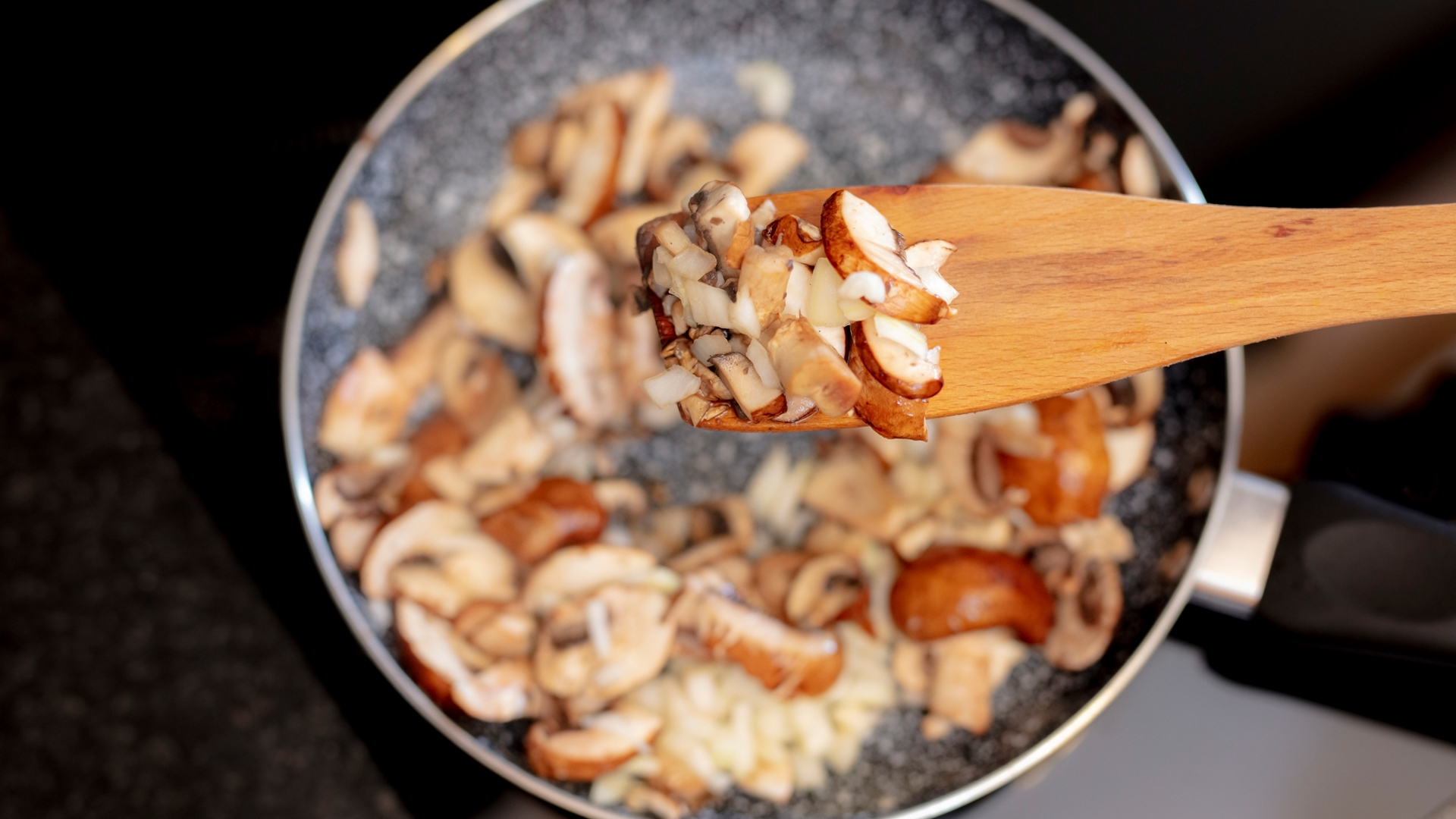 mushrooms cooking in a pan