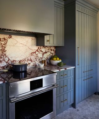 Isla Porter kitchen in Moody blue with a marble splashback