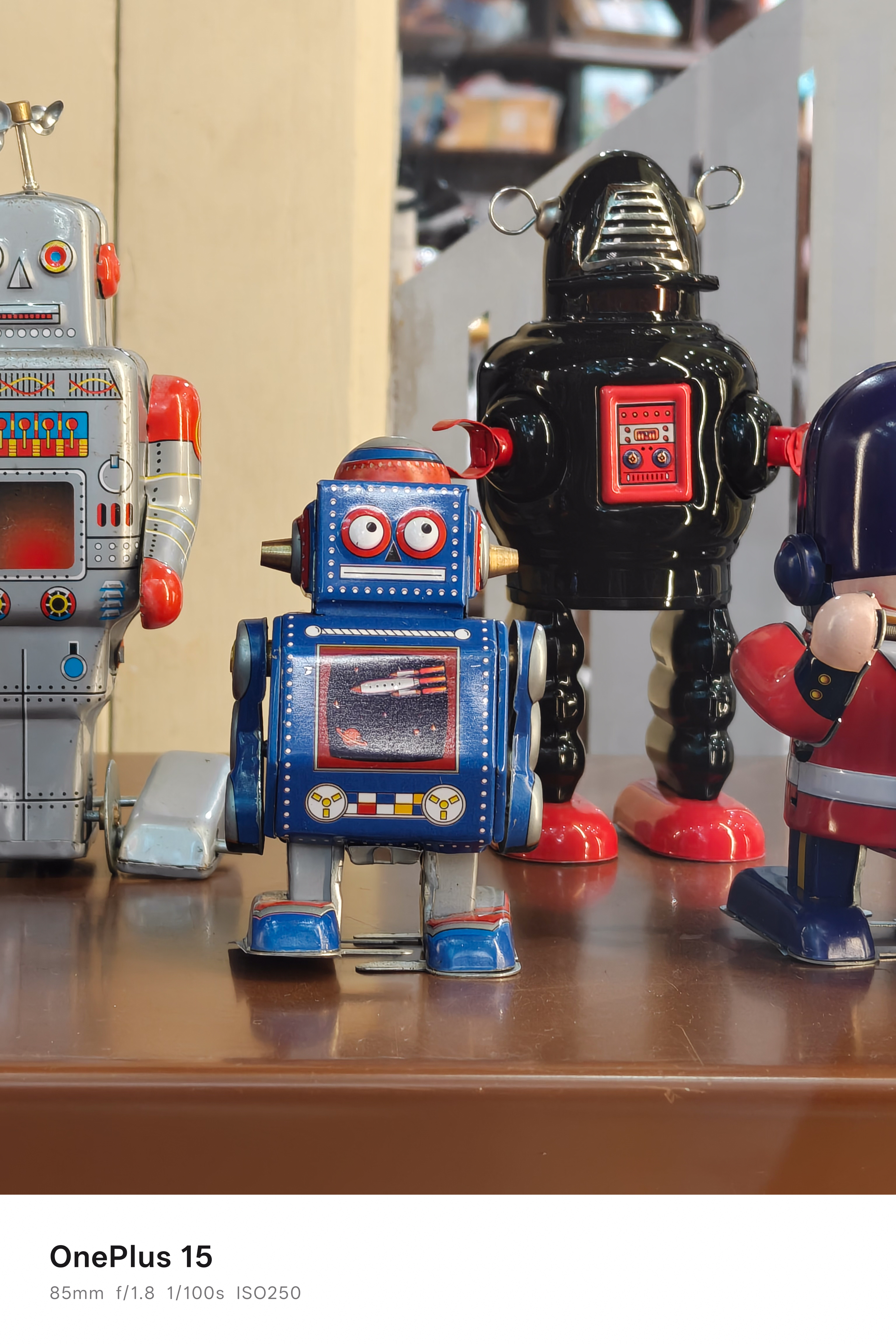 Toy robots lined up along a shelf