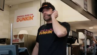 Ben Affleck working the drive thru window at Dunkin' Donuts.