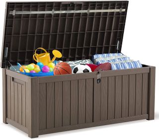 A brown plastic deck box filled with toys