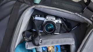 Nikon FE resting inside a open camera bag