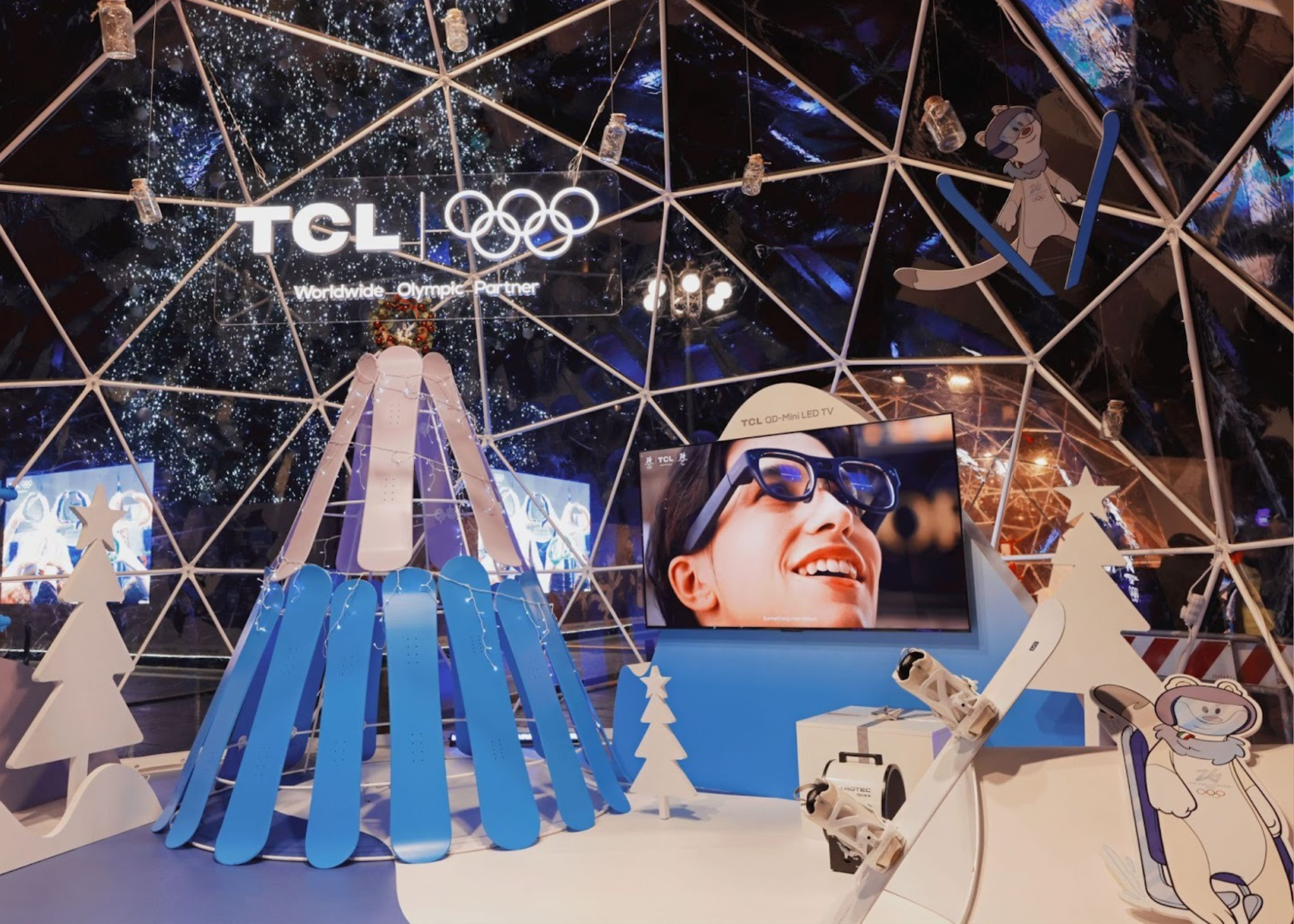 A transparent igloo-style installation featuring a high resolution TV