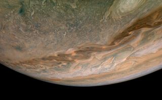 A new view from NASA’s Juno spacecraft shows a swirling jet stream in Jupiter’s northern hemisphere. This dark belt of swirling clouds is known as “Jet N4,” and Juno captured this close-up image of the feature during a flyby on Sept. 11, 2019, when the spacecraft was about 7,540 miles (12,140 kilometers) from the planet’s cloud tops. Citizen scientist Björn Jónsson created this enhanced image using data from the spacecraft's JunoCam imager.