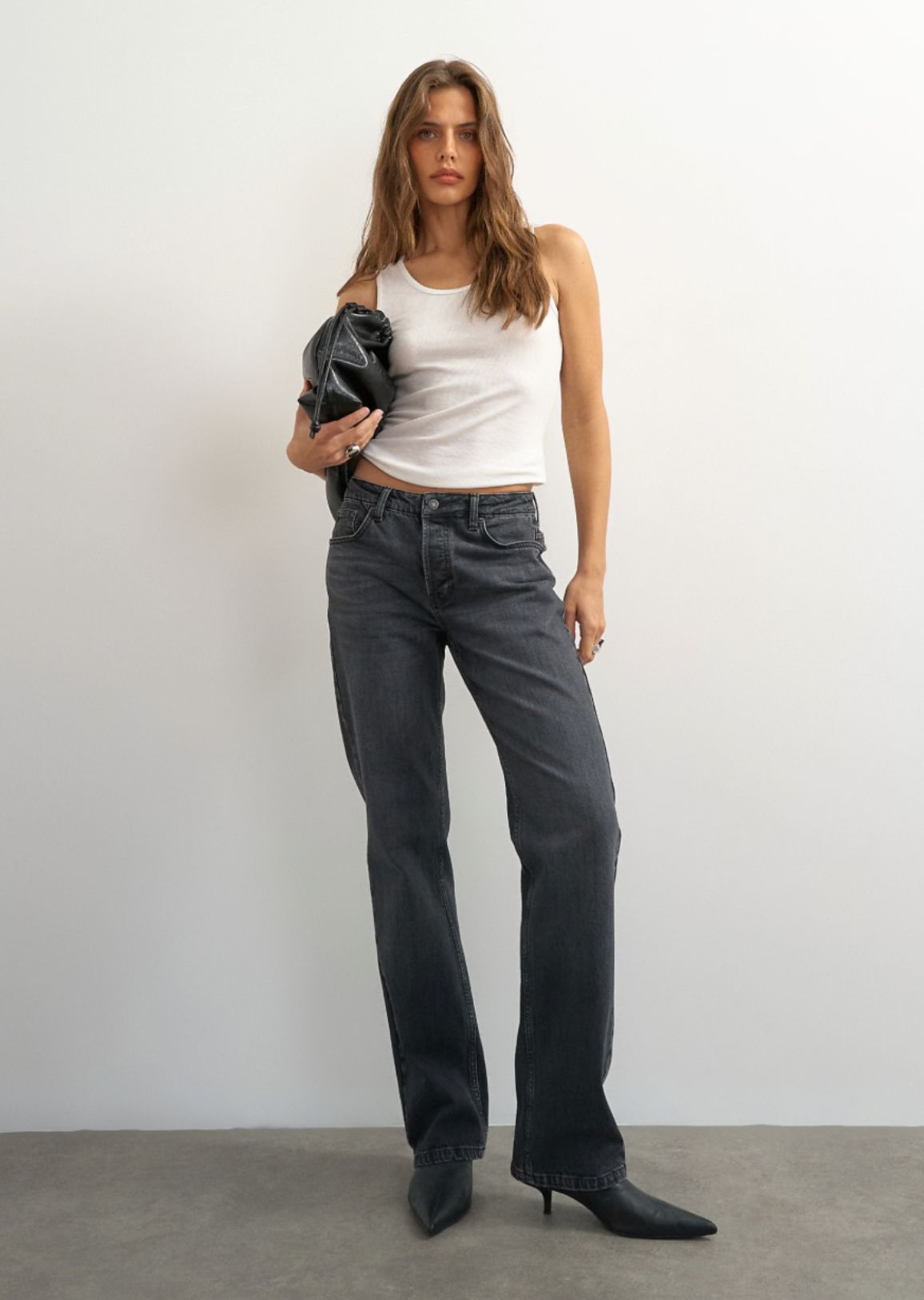 Model in the Topshop x Cara Delevingne jeans