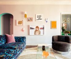 a colorful living room with a painted door arch