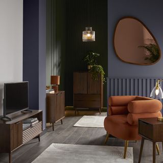 living area with navy blue walls and dark green alcove