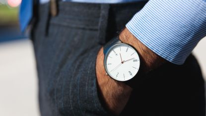 A stock photo of a businessman wearing a watch. 