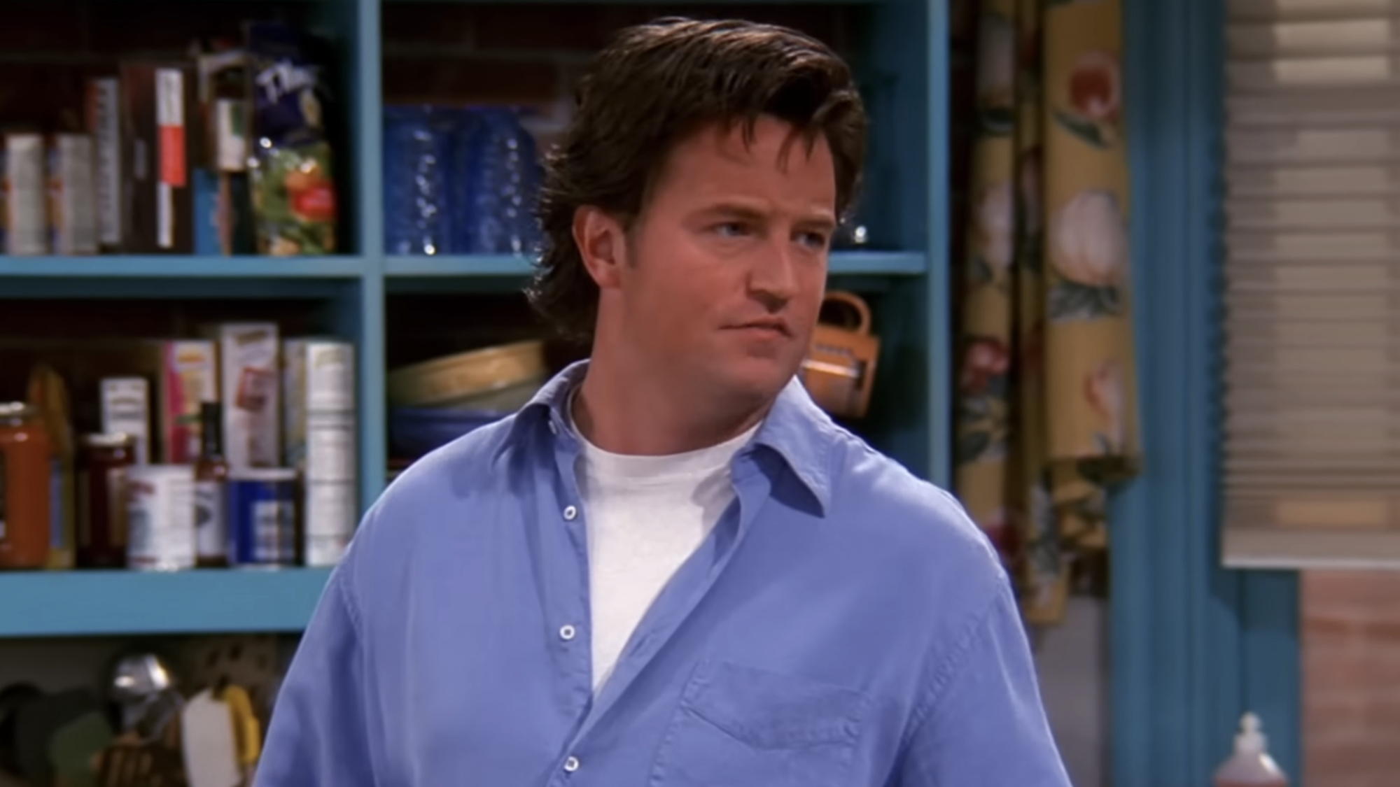 Chandler Bing (Matthew Perry) tries to offer advice to his friend, Rachel Green on Friends.
