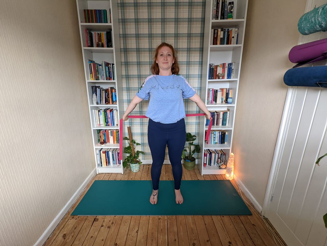 Woman doing flexibility exercises with resistance bands