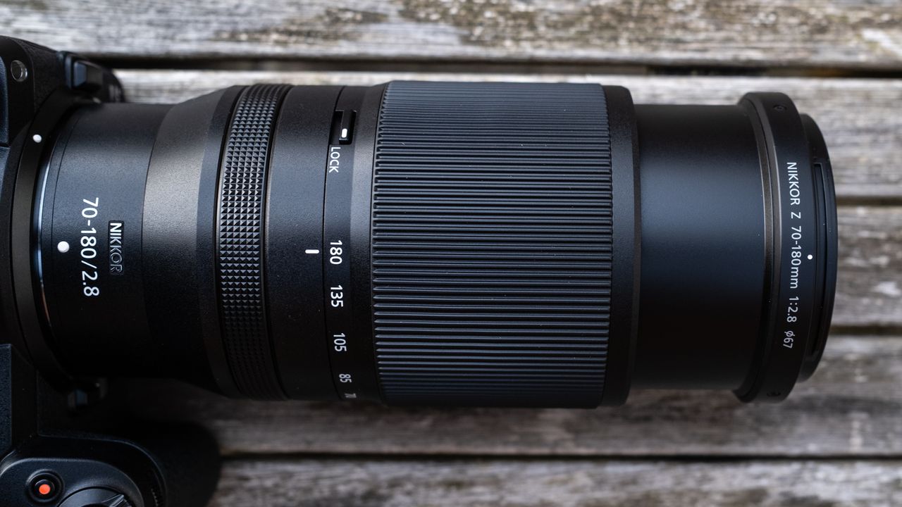 Nikkor Z 70-180mm f/2.8 attached to a Nikon Z 7II on a wooden outdoor table