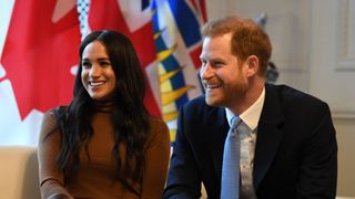 Prince Harry, Duke of Sussex and Meghan, Duchess of Sussex react during their visit to Canada House in 2020