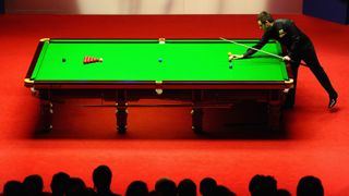 Ronnie O'Sullivan of England in action against Matthew Stevens of Wales during the World Snooker Championship Semi Final match at Crucible Theatre in Sheffield