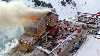 Fire brigades respond to a fire at a ski resort hotel in Bolu, northwestern Turkey, which has killed at least 66 people