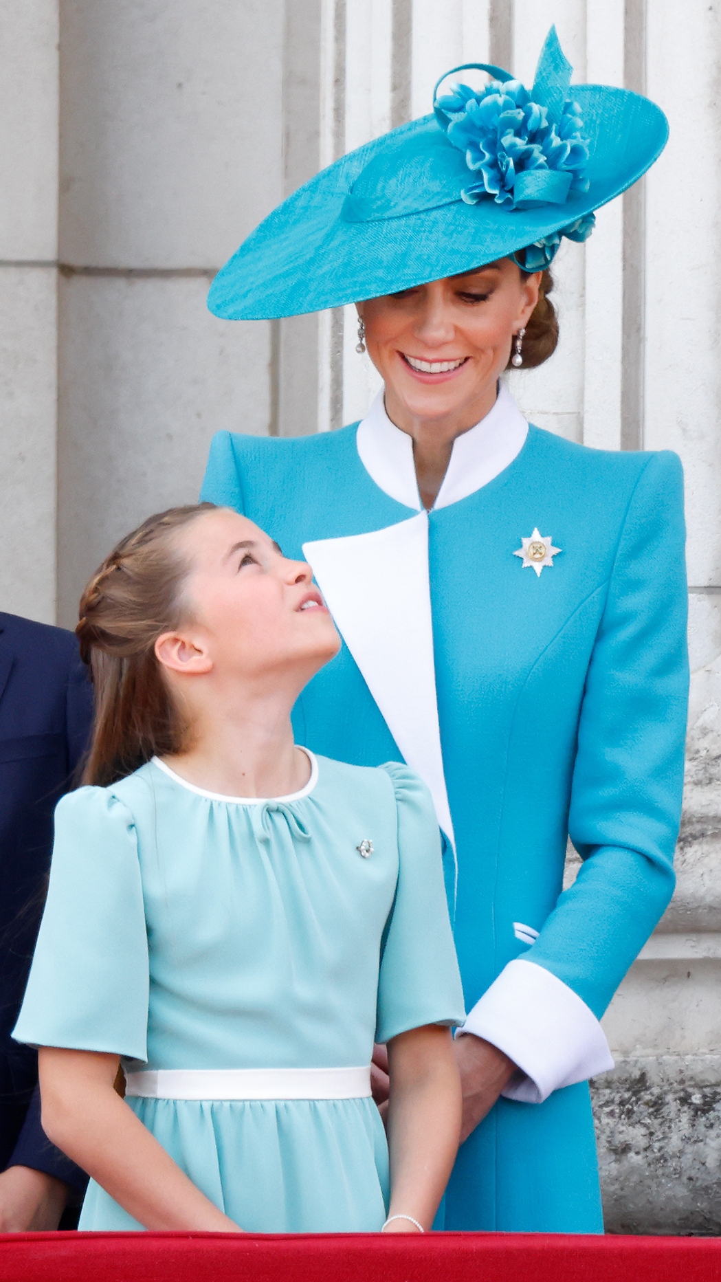Catherine, Princess of Wales and Princess Charlotte of Wales watch an RAF flypast from the balcony of Buckingham Palace