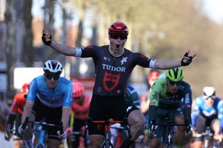 Tudor Pro Cycling Team's Dutch cyclist Arvid De Kleijn celebrates as he crosses the finish line during the 2nd stage of the Paris-Nice cycling race, 179 km between Thoiry and Montargis, on March 4, 2024. (Photo by Thomas SAMSON / AFP)