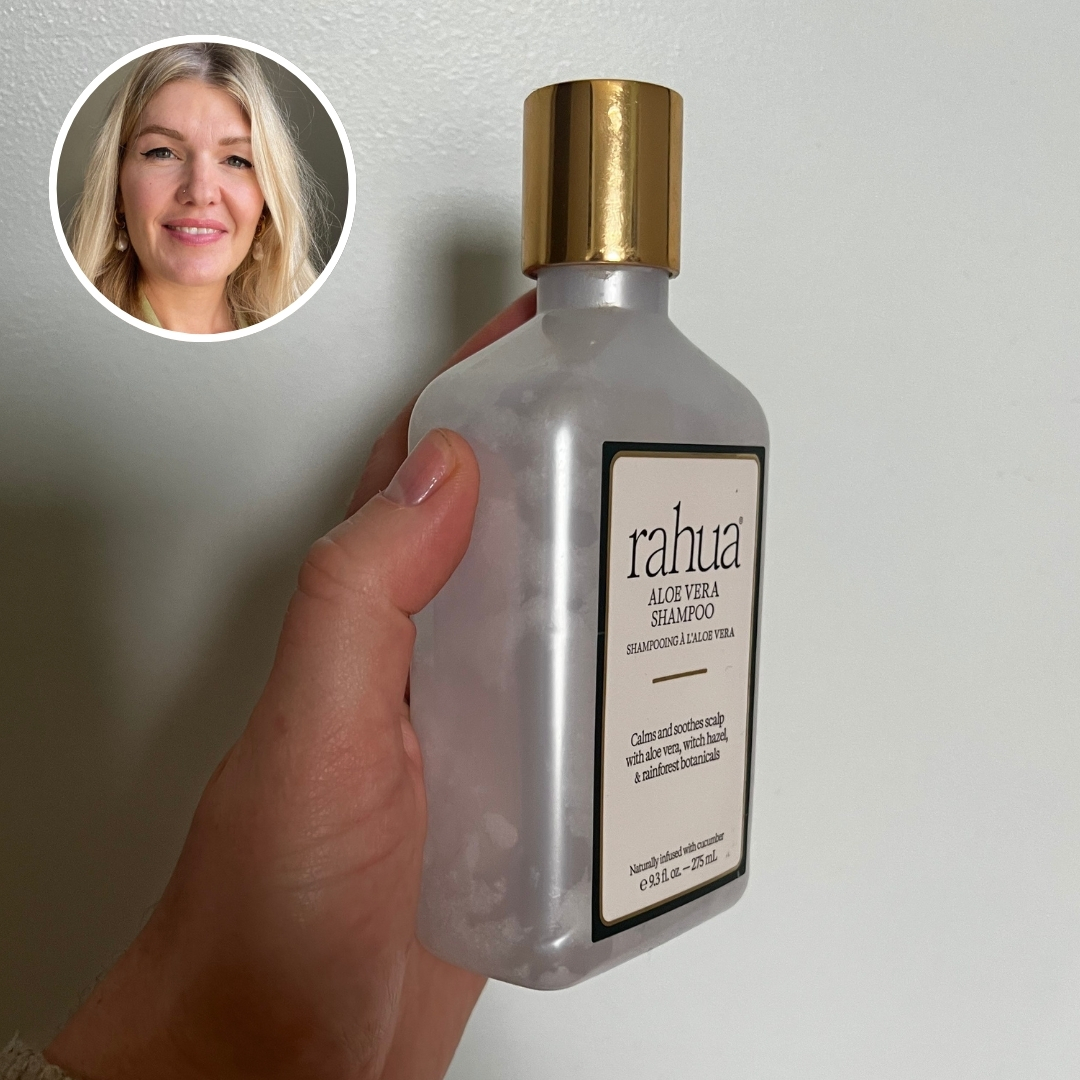 Hand holding an empty bottle of Rahua Aloe Vera Shampoo, with circular photo of Fiona McKim in top left corner