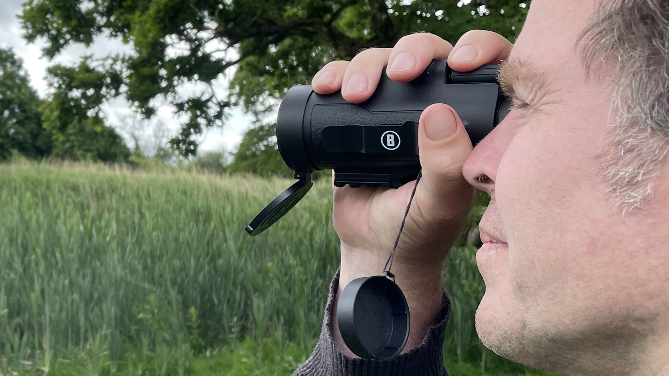 Bushnell Legend in the hands of the author with the lens cap removed but attached by a cord.