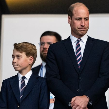 Prince George and Prince William are so alike, both pictured wearing matching suits and pursing their lips in the exact same way