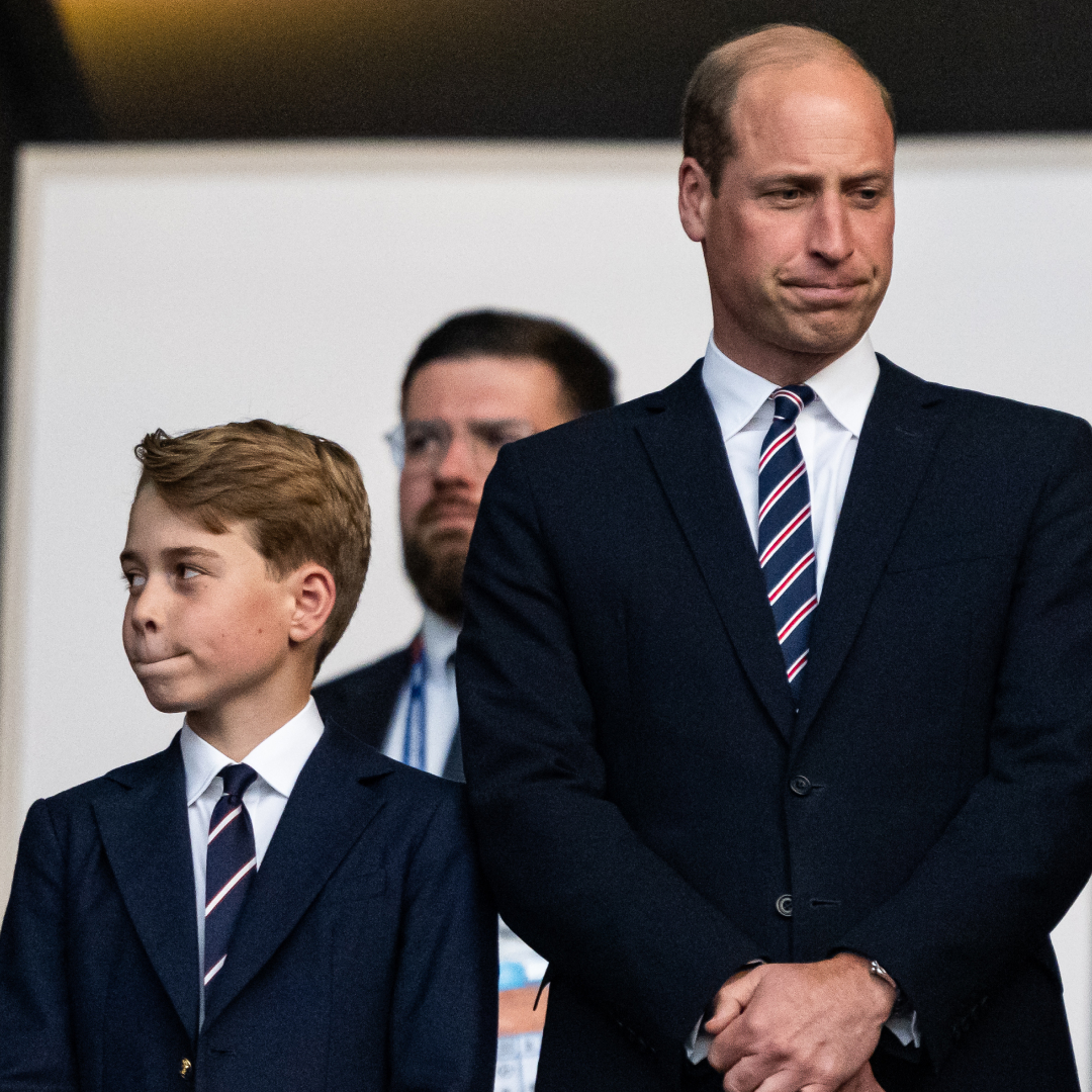 Prince George and Prince William are so alike, both pictured wearing matching suits and pursing their lips in the exact same way