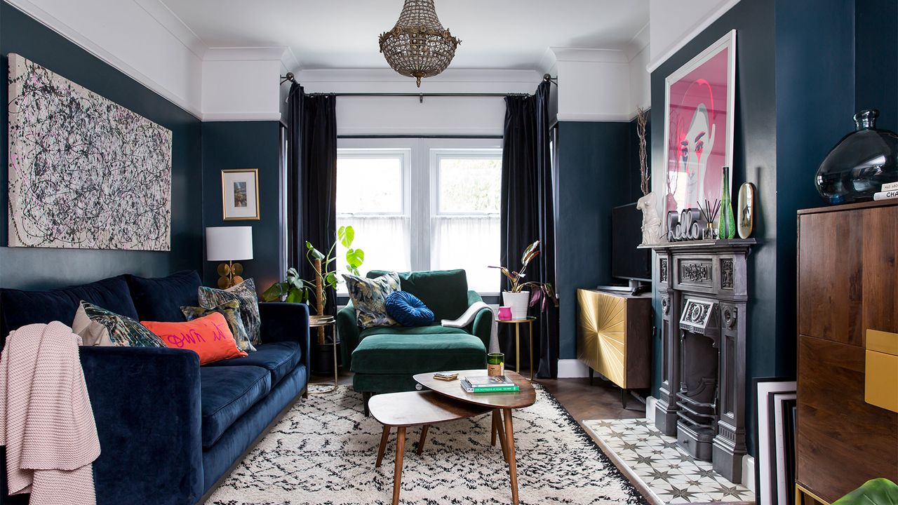 blue living room with velvet sofa and fireplace