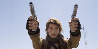 Milla Jovovich dual-weilding guns