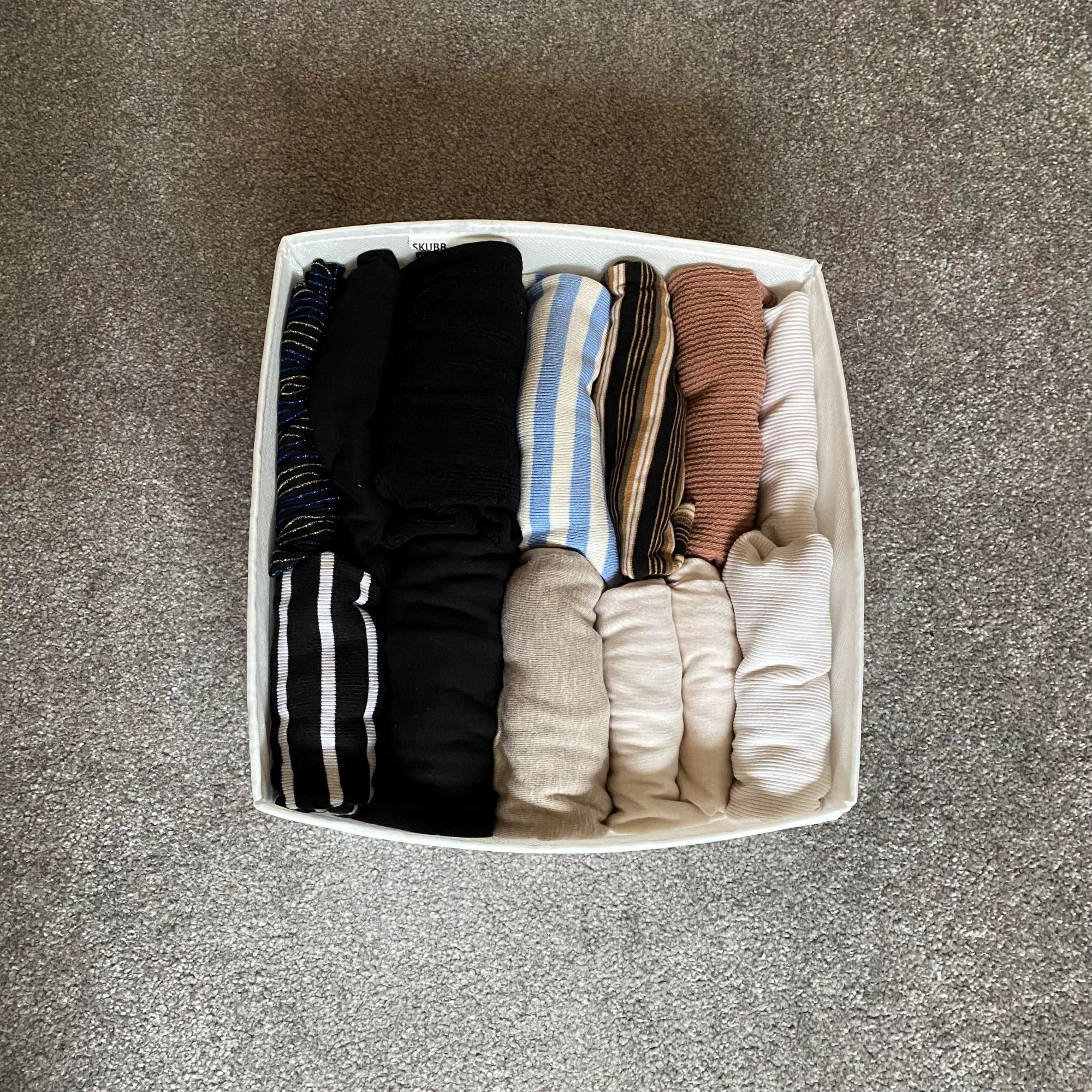 Katie trying the KonMari folding method to organise her clothes
