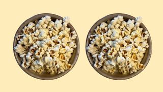 Two bowls of popcorn representing 200 calories of snacks