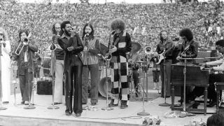 Rock band "Tower of Power" (L-R) Greg Adams, Mic Gillette, Doc Kupka, Lenny Williams, Emilio Castillo, Lenny Pickett, Rocco Prestia, Bruce Conte and Chester Thompson perform onstage in circa 1974 in California.