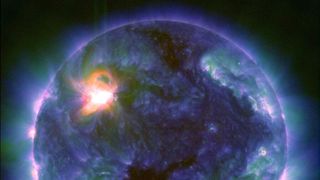 An ultraviolet image of the sun showing a massive explosion on its surface