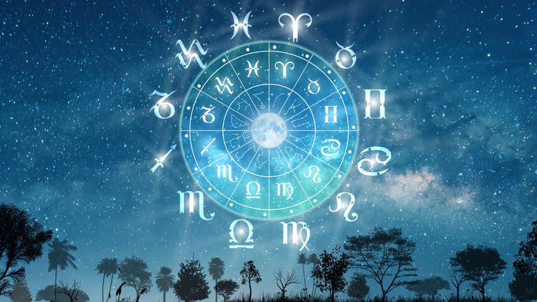 April Full Moon 2022: Astrological zodiac signs inside of horoscope circle. Landscape with The stars and moon over the zodiac wheel and milky way background. The power of the universe concept.