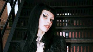 Harpy sitting on some steps