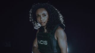 Olivia Swann's Michelle Mackey wearing her NCIS vest in the nighttime in NCIS: Sydney