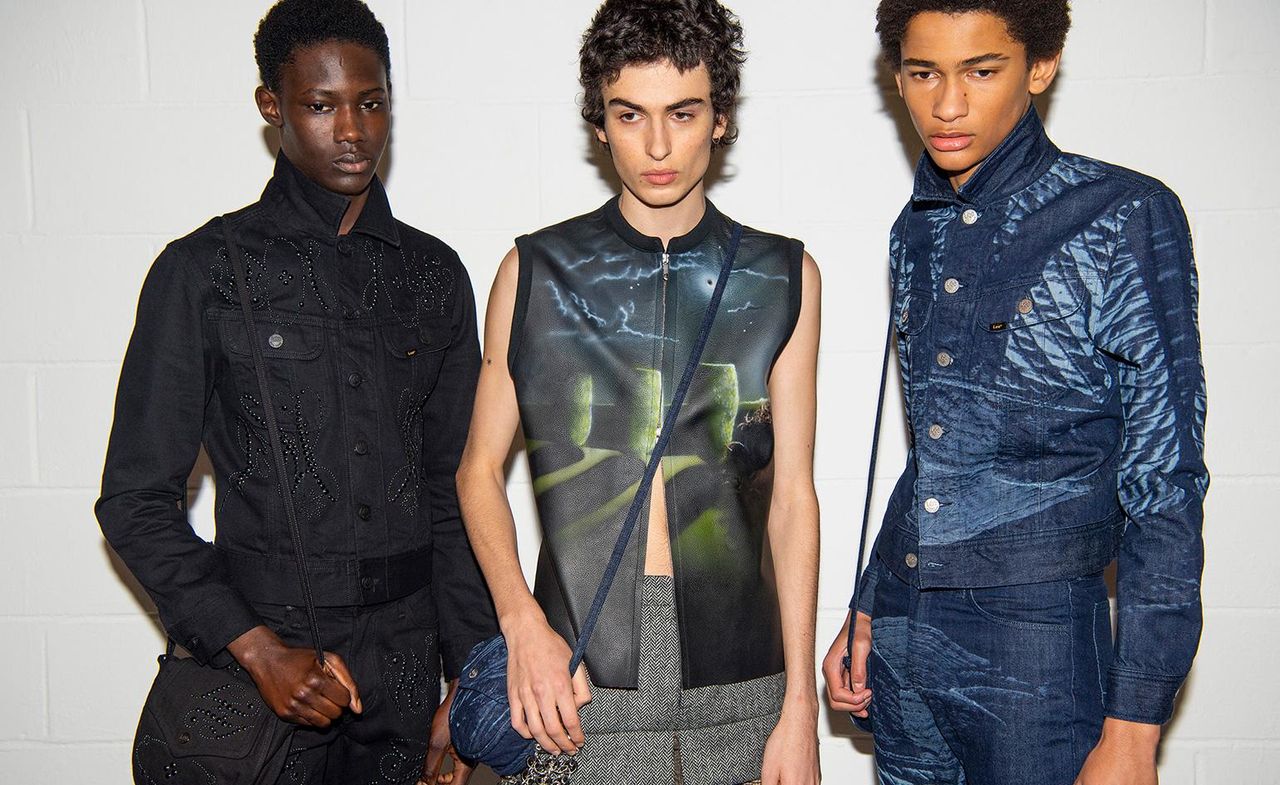 3 male models in denim &amp; leather looking down