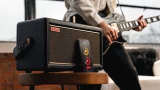 A guitarist plays through Positive Grid's Spark 2 amplifier