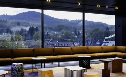 long row of chairs in font of a big window wall