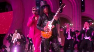 Ryan Gosling sings while Slash plays guitar on stage at the 2024 Oscars.