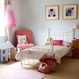 chidren bedroom with white bed pink cushion pink chair