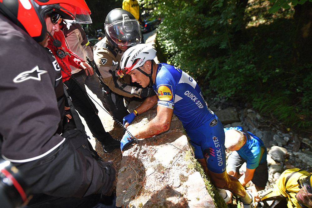 Philippe Gilbert (Quick-Step Floors) crashed and went over the edge of a guardrail, climbing out back to the roadside