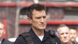 Nathan Fillion as John in a police uniform in The Rookie season 7